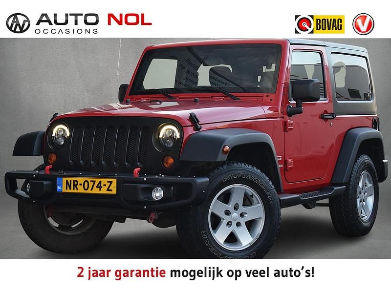 Rood Occasion 2012 Jeep Wrangler Sahara SUV | € 29.950 - Afbeelding 1/4