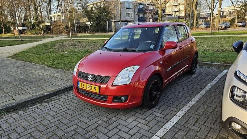 Occasion Suzuki Swift 92 PK (67 kW) 2009 Rood Sedan