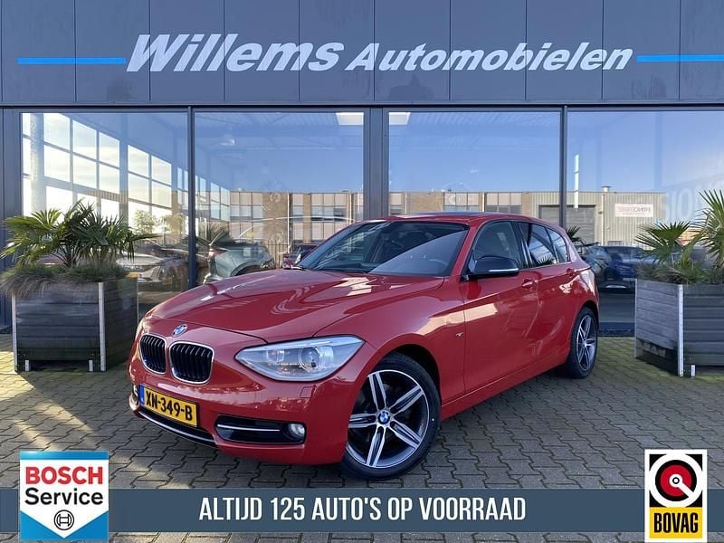 Rood Gebruikt 2012 BMW 118 Executive Hatchback | € 12.750 (Eerlijke prijs) - Afbeelding 1/4