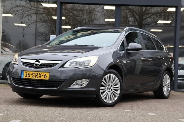 Grijs Gebruikt 2011 Opel Astra Cosmo Stationwagen | € 2.995 (Goede deal) - Afbeelding 1/4
