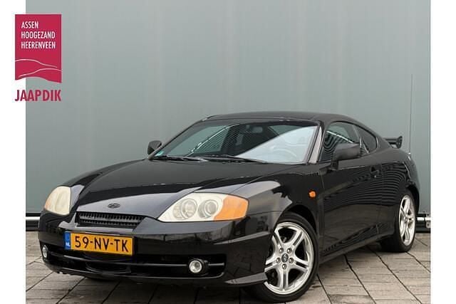 Zwart (metallic) Gebruikt 2004 Hyundai Coupé Dynamiq Coupé | € 1.299 - Afbeelding 1/4