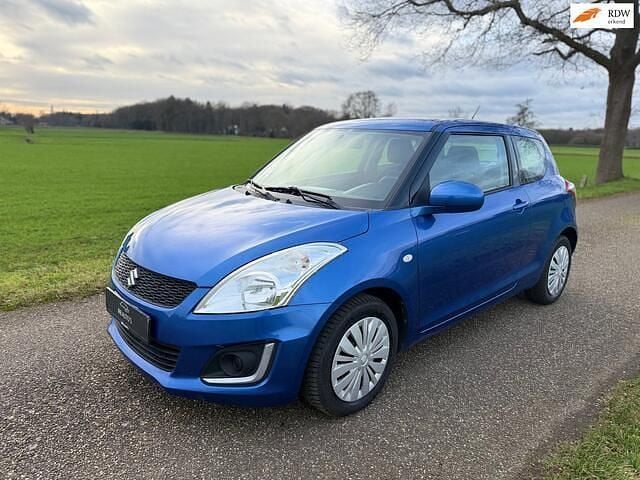Blauw (metallic) Gebruikt 2014 Suzuki Swift Hatchback | € 6.950 (Eerlijke prijs) - Afbeelding 1/4