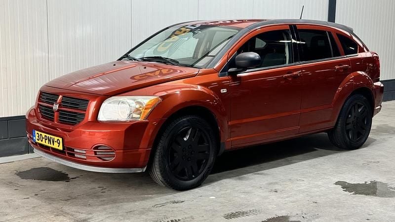 Oranje Gebruikt 2011 Dodge Caliber Hatchback | € 2.998 (Goede deal) - Afbeelding 1/4