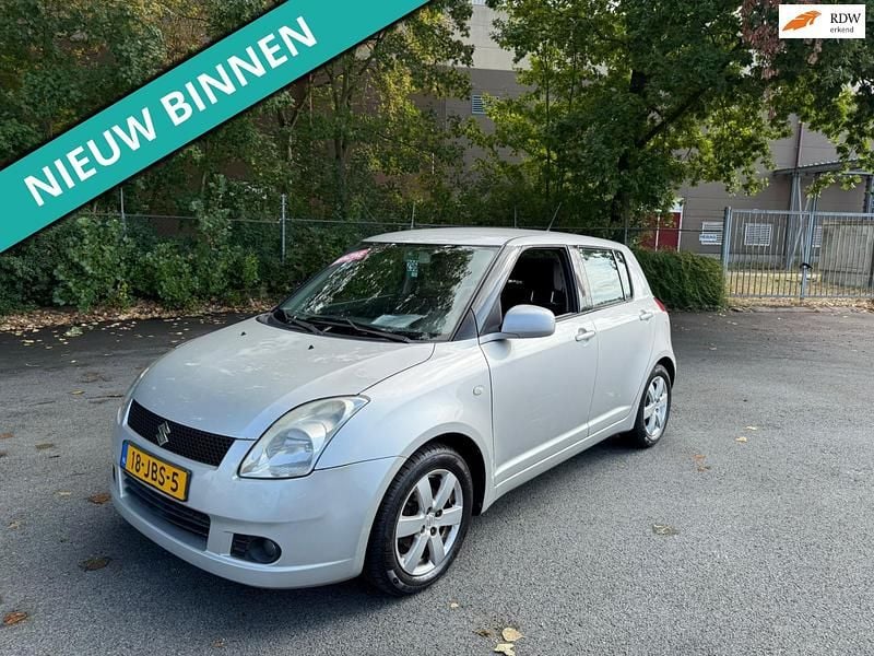 Grijs Gebruikt 2009 Suzuki Swift Hatchback | € 1.999 (Super prijs) - Afbeelding 1/4