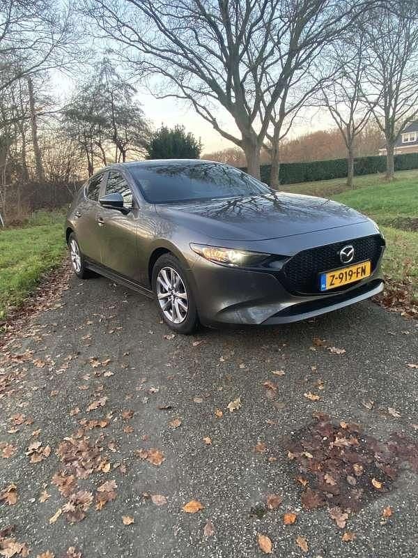 Grijs Occasion 2021 Mazda 3 Hatchback | € 23.850 (Eerlijke prijs) - Afbeelding 1/4