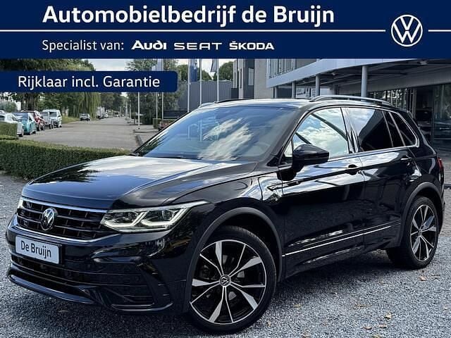 Zwart Gebruikt 2023 VW Tiguan R-line SUV | € 40.650 (Eerlijke prijs) - Afbeelding 1/4