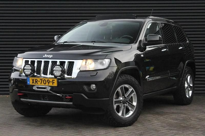 Zwart (metallic) Gebruikt 2012 Jeep Grand Cherokee Overland SUV | € 15.950 - Afbeelding 1/4