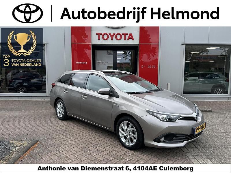 Bruin Gebruikt 2016 Toyota Auris Hybrid Stationwagen | € 14.999 (Eerlijke prijs) - Afbeelding 1/4