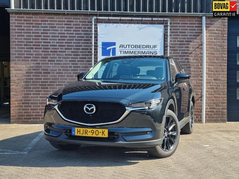 Zwart, metallic lak Gebruikt 2021 Mazda CX-5 Signature SUV | € 35.950 (Iets duurder) - Afbeelding 1/4
