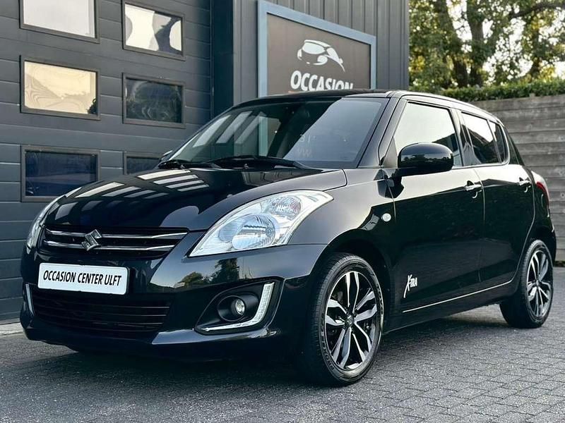 Zwart (metallic) Occasion 2015 Suzuki Swift X-TRA Hatchback | € 9.450 (Eerlijke prijs) - Afbeelding 1/4