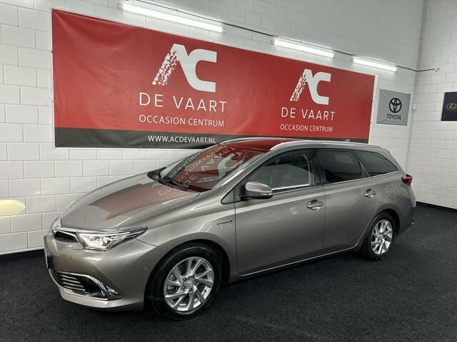 Bruin Gebruikt 2015 Toyota Auris Executive Stationwagen | € 14.499 (Eerlijke prijs) - Afbeelding 1/4