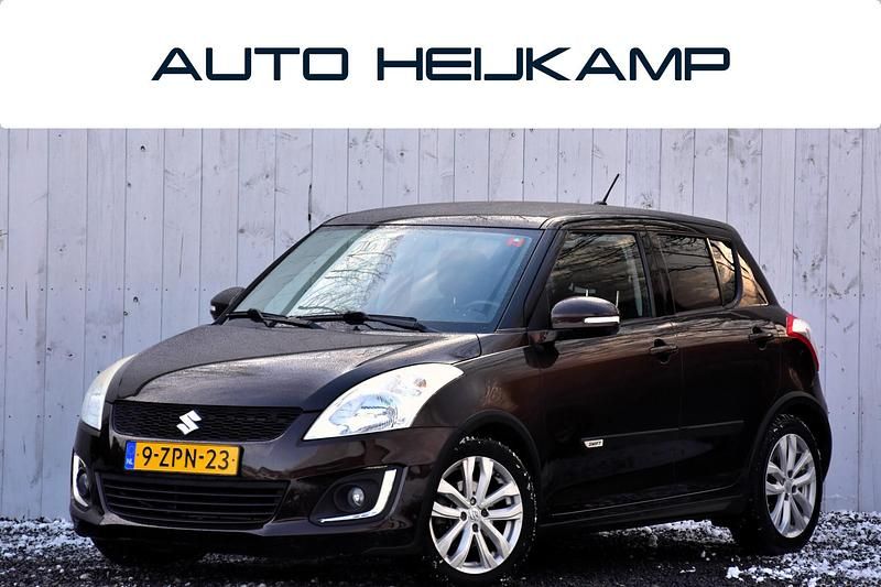 Bruin Occasion 2015 Suzuki Swift Exclusive Hatchback | € 9.450 (Eerlijke prijs) - Afbeelding 1/4
