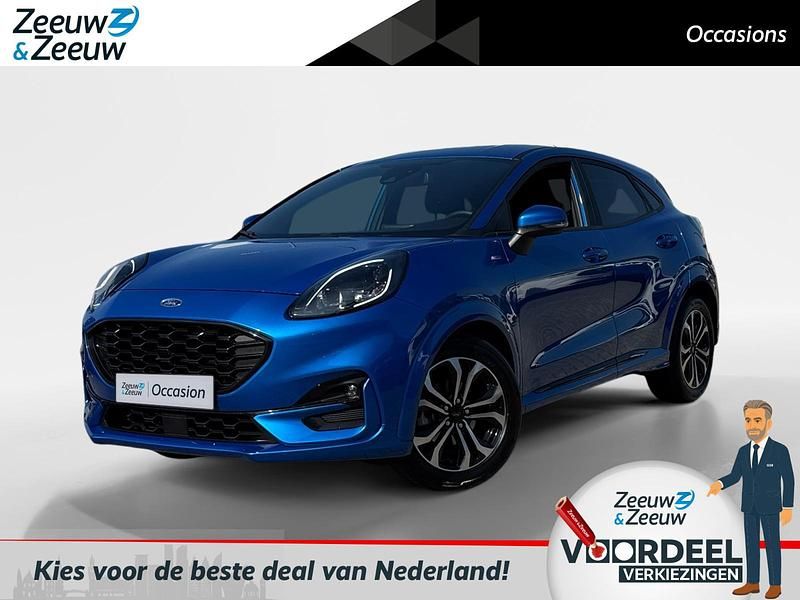 Desert island blue (pn4fz) Gebruikt 2022 Ford Puma Gen-E ST-Line SUV | € 21.440 (Eerlijke prijs) - Afbeelding 1/4