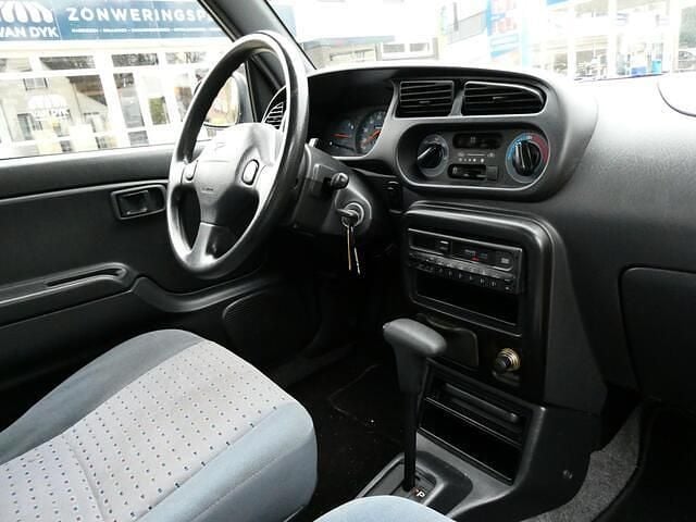 Occasion Daihatsu Cuore 56 PK (41 kW) 2001 Groen Hatchback