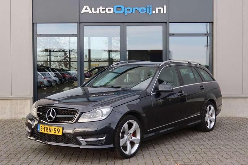 Zwart (metallic) Gebruikt 2014 Mercedes C180 Ambition Stationwagen | € 13.845 (Goede deal) - Afbeelding 1/4