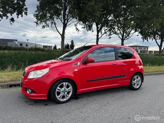 Rood Gebruikt 2009 Chevrolet Aveo Hatchback | € 2.450 (Iets duurder) - Afbeelding 1/4