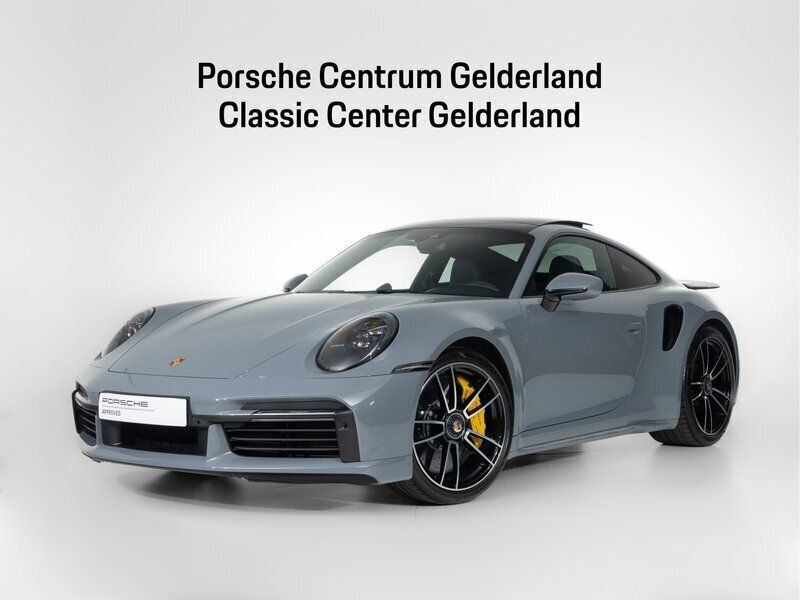 Grijs Gebruikt 2023 Porsche 911 Turbo S Coupé | € 274.900 (Goede deal) - Afbeelding 1/4