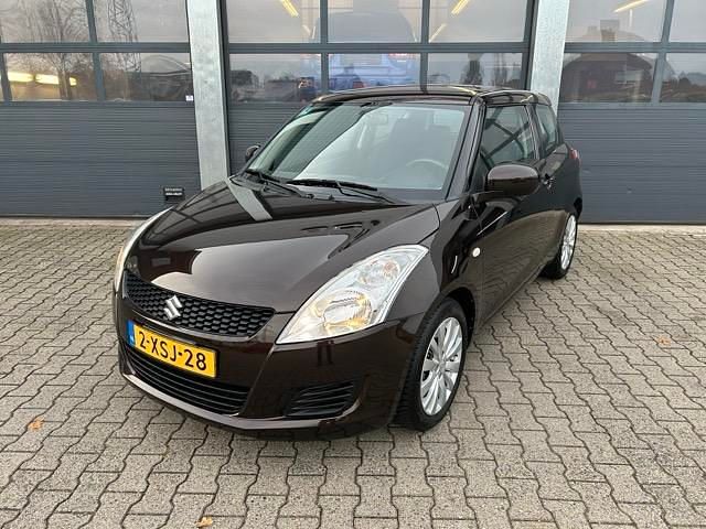 Bruin Gebruikt 2014 Suzuki Swift Hatchback | € 9.830 (Iets duurder) - Afbeelding 1/4