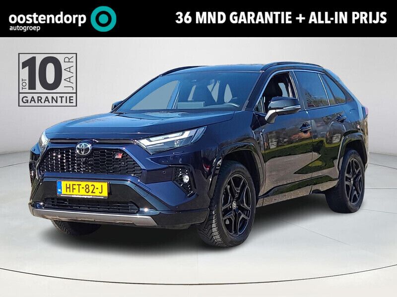 Midnight blue metallic met zwart dak 2ra blauw Gebruikt 2024 Toyota RAV4 Hybrid Sport SUV | € 53.950 (Eerlijke prijs) - Afbeelding 1/4