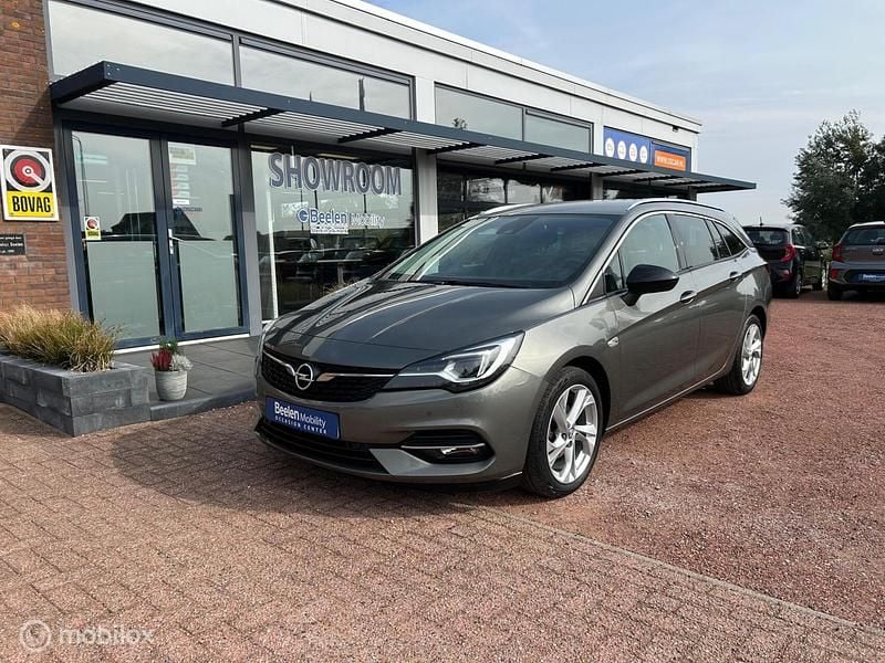 Grijs Gebruikt 2022 Opel Astra Edition Stationwagen | € 15.900 (Goede deal) - Afbeelding 1/4