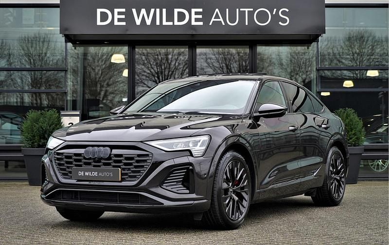 Bruin (metallic) Gebruikt 2023 Audi Q8 Sportback e-tron S-Line SUV | € 54.900 - Afbeelding 1/4