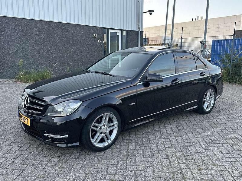 Zwart Gebruikt 2011 Mercedes C180 AMG line Sedan | € 11.450 (Goede deal) - Afbeelding 1/4