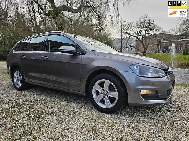 Grijs Gebruikt 2014 VW Golf VII Highline Stationwagen | € 6.999 (Eerlijke prijs) - Afbeelding 1/4