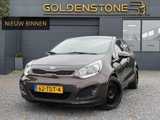 Bruin Gebruikt 2012 Kia Rio Hatchback | € 3.843 (Eerlijke prijs) - Afbeelding 1/4