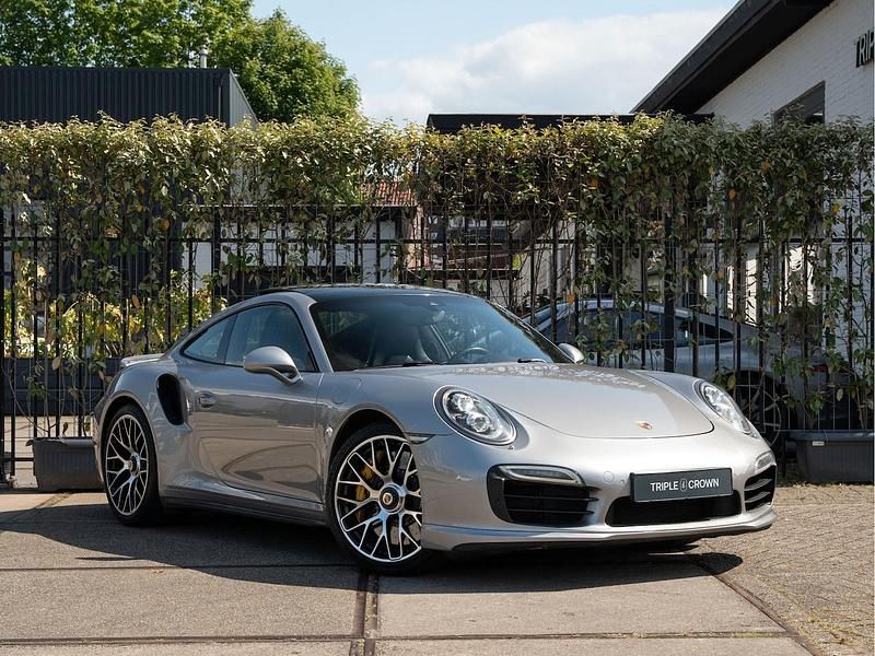 Grijs (metallic) Gebruikt 2014 Porsche 911 Turbo S Sport Coupé | € 79.950 - Afbeelding 1/4