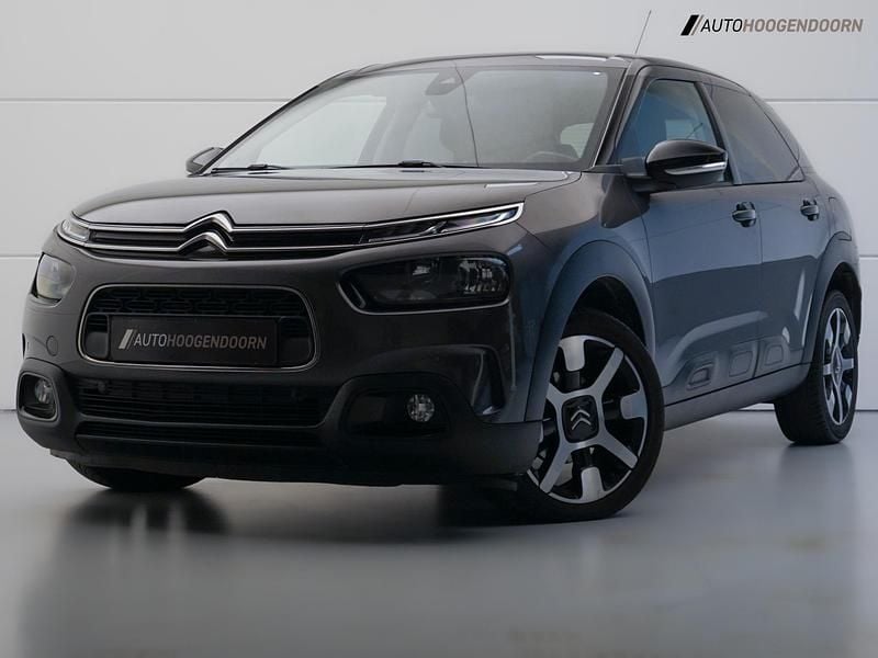 Grijs, metallic lak Gebruikt 2018 Citroën C4 Cactus PureTech Hatchback | € 12.745 (Eerlijke prijs) - Afbeelding 1/4