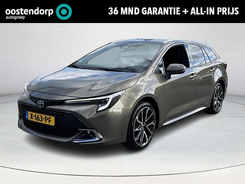 Groen Gebruikt 2023 Toyota Corolla Hybrid Executive Stationwagen | € 35.900 - Afbeelding 1/4