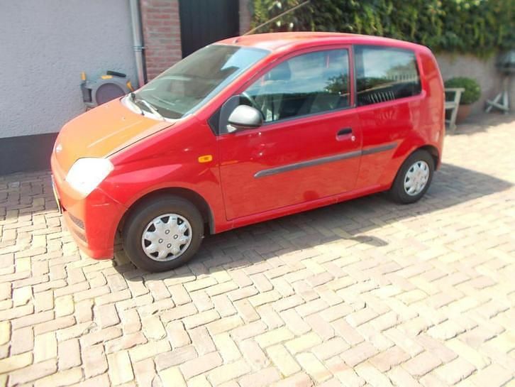 Occasion Daihatsu Cuore 59 PK (43 kW) 2007 Rood Hatchback
