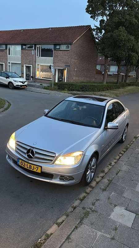 Grijs Gebruikt 2009 Mercedes C180 Sedan | € 6.750 (Goede deal) - Afbeelding 1/4