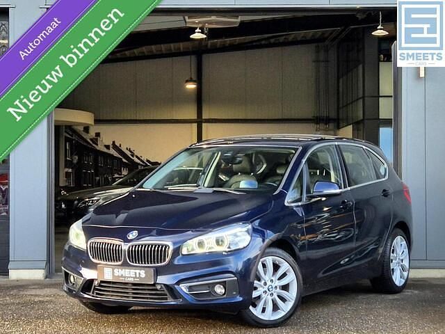 Blauw (metallic) Gebruikt 2015 BMW 220 Luxury Line Stationwagen | € 15.500 (Iets duurder) - Afbeelding 1/4