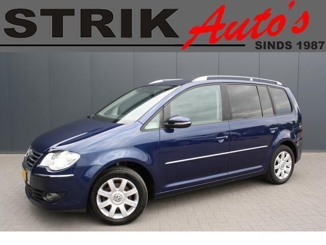 Blauw, metallic lak Gebruikt 2010 VW Touran Highline MPV | € 2.849 (Super prijs) - Afbeelding 1/4