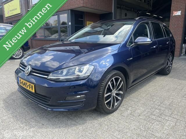 Blauw, metallic lak Gebruikt 2015 VW Golf VII Highline Stationwagen | € 14.950 (Eerlijke prijs) - Afbeelding 1/4