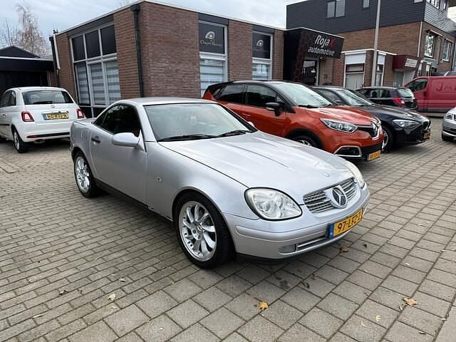 Grijs Gebruikt 1999 Mercedes SLK230 Cabriolet | € 2.499 (Super prijs) - Afbeelding 1/4