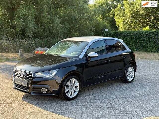 Zwart, metallic lak Gebruikt 2013 Audi A1 Sportback Attraction Hatchback | € 9.250 (Eerlijke prijs) - Afbeelding 1/4