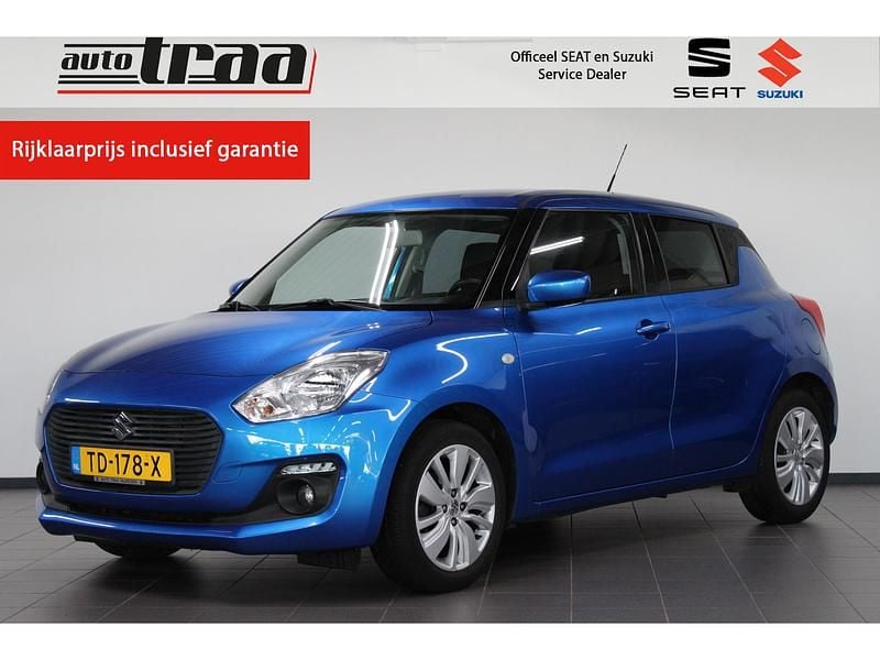 Blauw (metallic) Gebruikt 2018 Suzuki Swift Hatchback | € 15.450 (Iets duurder) - Afbeelding 1/4