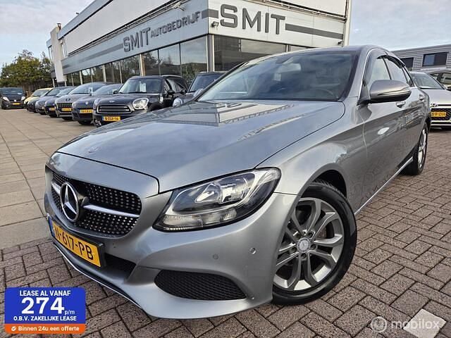 Grijs (metallic) Occasion 2016 Mercedes C180 Prestige Sedan | € 16.900 (Super prijs) - Afbeelding 1/4