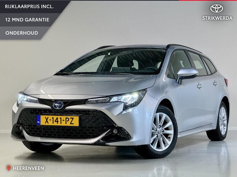 Grijs Gebruikt 2024 Toyota Corolla Hybrid Active Stationwagen | € 27.899 - Afbeelding 1/4