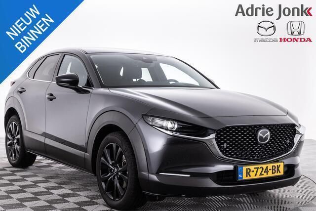 Machine gray Gebruikt 2022 Mazda CX-30 Homura-Line SUV | € 26.939 (Eerlijke prijs) - Afbeelding 1/4