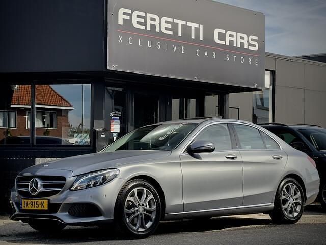 Grijs Gebruikt 2016 Mercedes C180 Prestige Sedan | € 19.900 (Eerlijke prijs) - Afbeelding 1/4