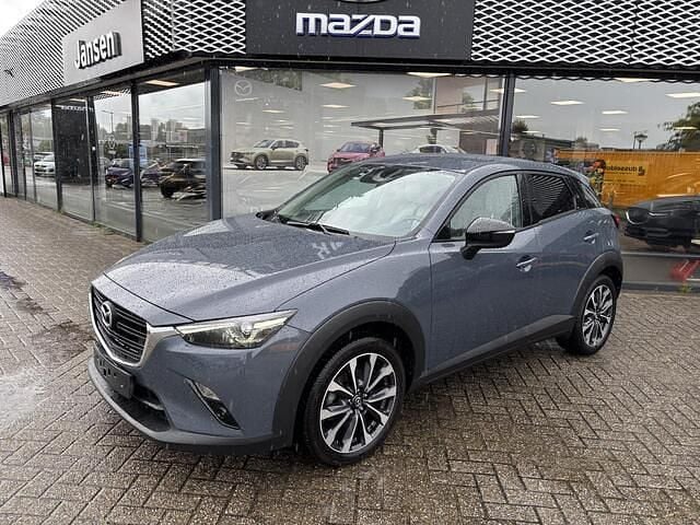 Polymetal gray metallic (47c) Gebruikt 2021 Mazda CX-3 Luxury SUV | € 24.900 (Eerlijke prijs) - Afbeelding 1/3