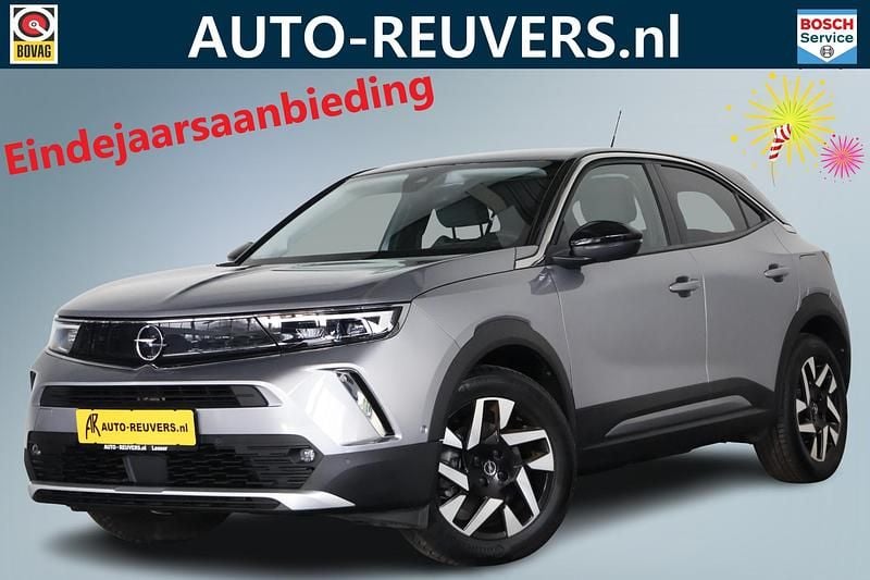 Grijs Gebruikt 2022 Opel Mokka-e Elegance SUV | € 18.900 (Eerlijke prijs) - Afbeelding 1/4