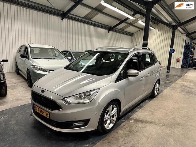 Grijs (metallic) Gebruikt 2016 Ford Grand C-Max Titanium MPV | € 9.950 - Afbeelding 1/4
