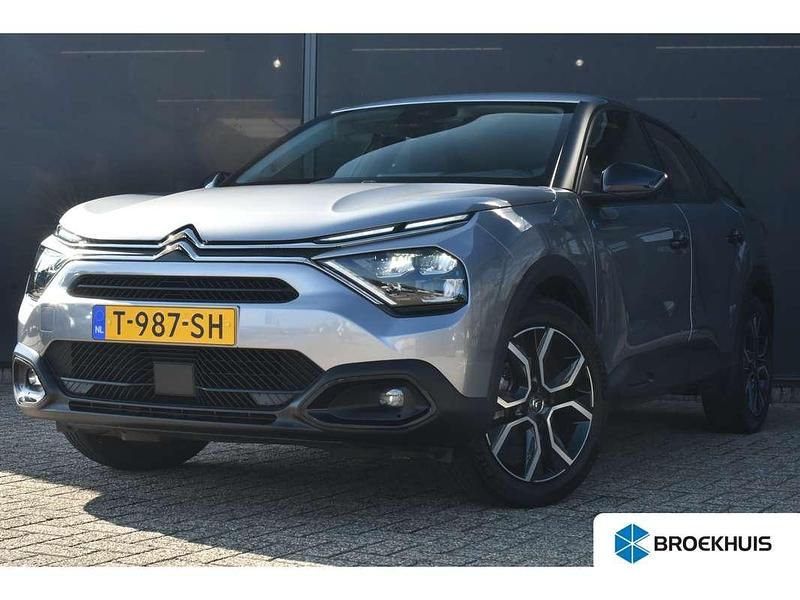 Grijs, metallic lak Gebruikt 2023 Citroën e-C4 Feel SUV | € 17.800 (Eerlijke prijs) - Afbeelding 1/4