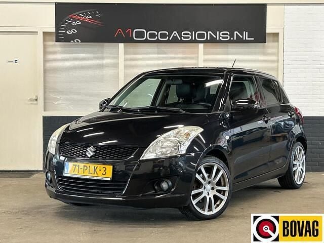Zwart Gebruikt 2011 Suzuki Swift Exclusive Hatchback | € 6.995 (Eerlijke prijs) - Afbeelding 1/4