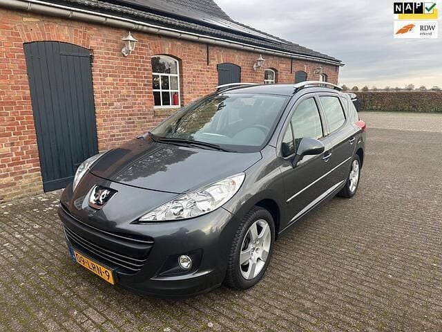 Grijs (metallic) Gebruikt 2010 Peugeot 207 Stationwagen | € 3.900 (Eerlijke prijs) - Afbeelding 1/4