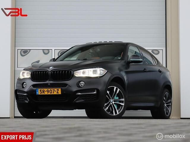 Zwart (metallic) Gebruikt 2015 BMW X6 M50 SUV | € 21.940 (Goede deal) - Afbeelding 1/4
